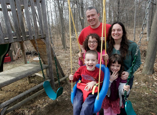 Shown in these pictures is the Cooper family: 3-year-old Matthew, 6-year-old Sarah, 9-year-old Jena, mom Gina and dad Erik. Matthew participated in the PLAY Projected (Play and Language for Autistic Youngsters) with Joanna Evans (also shown in blue shirt) of the Delaware County Board of Developmental Disabilities. Matthew has shown a huge improvement since going through the program.