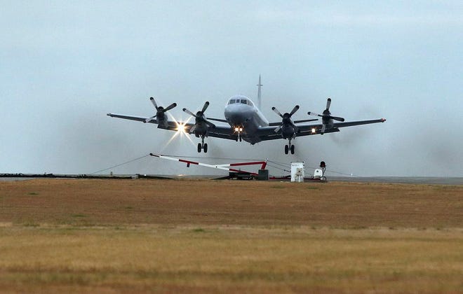 A Royal Australia Air Force AP-3C Orion takes off from RAAF Base Pearce in Perth, Australia to resume the search for missing Malaysia Airlines Flight MH370 in the southern Indian Ocean, Wednesday, March 26, 2014. As frustration was setting in, calmer seas returned Wednesday and the search for the remains of Flight 370 began anew in remote waters of the Indian Ocean off western Australia. (AP Photo/Rob Griffith)
