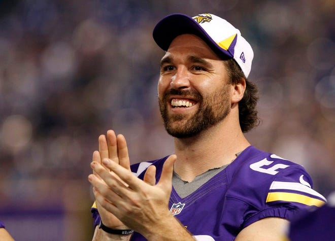 In this Aug. 29, 2013, file photo, Minnesota Vikings defensive end Jared Allen laughs on the sideline during the second half of an NFL preseason football game against the Tennessee Titans in Minneapolis. The Chicago Bears replaced one accomplished veteran pass rusher with another Wednesday, March 26, 2014, when they agreed to terms with Allen on a four-year contract. A person with knowledge of the agreement told The Associated Press that Allen will get $15.5 million guaranteed on a deal that could be worth as much as $32 million. The person requested anonymity because the terms have not been announced.