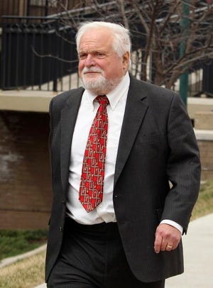 In this Tuesday, March 25, 2014 photo, Barrett Rochman, 71, a southern Illinois businessman and philanthropist, leaves U.S. District Court in East St. Louis, Ill., after being sentenced to more than a year in prison in a bid-rigging scheme. Federal investigators say Rochman made $1 million in a bid-rigging scandal orchestrated by then-Madison County Treasurer Fred Bathon, a Democrat who served more than 10 years as treasurer before resigning in 2009. (AP Photo/Belleville News-Democrat, Derik Holtmann)