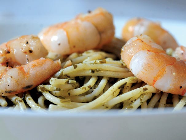 For a lighter spring dish, try garlic shrimp with pesto pasta.