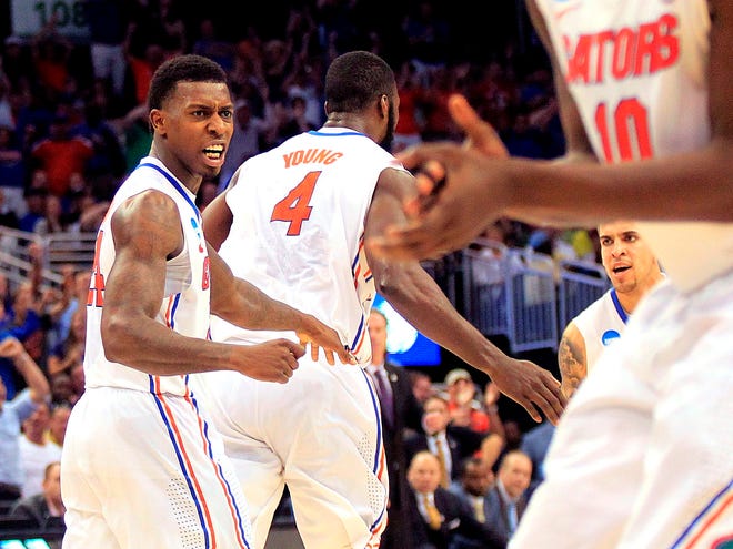 Florida senior forward Casey Prather, left, celebrates after getting an assist on an alley-oop against Pittsburgh on Saturday in Orlando. The Jackson, Tenn., native will be playing closer to home Thursday.