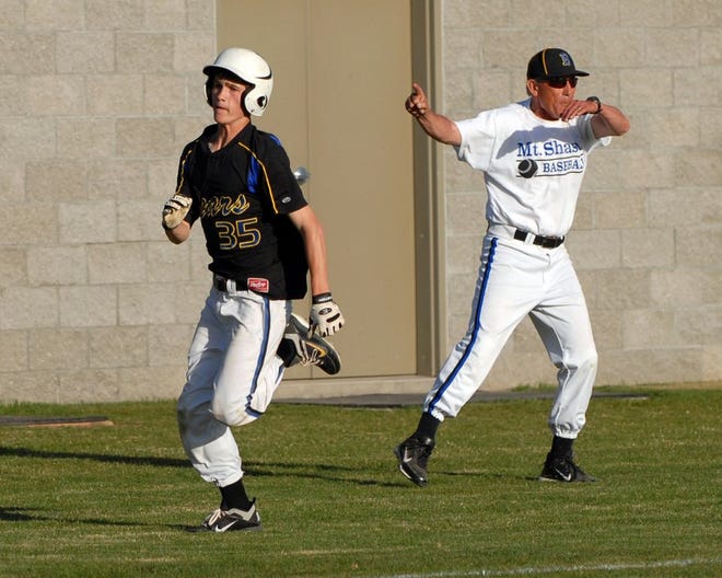 In this file photo from May 2013, then assistant coach Gary Woods directs traffic as Chet Bolstridge heads home with the winning run in a game against Burney. Woods is the Bears' head coach this season. They're 6-2, and Bolstridge leads the offense with a .750 batting average and .818 on-base percentage.