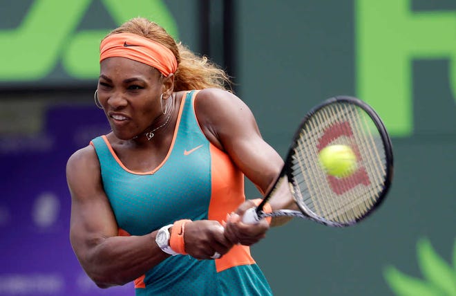 Serena Williams returns to Maria Sharapova, of Russia, at the Sony Open Tennis tournament in Key Biscayne, Fla., Thursday, March 27, 2014. (AP Photo/Alan Diaz)