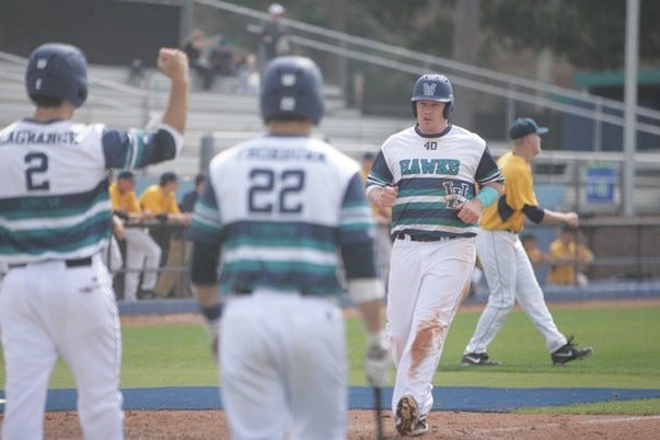 Corey Dick crosses home plate Sunday during UNCW's 13-10 home-field win against West Virginia. Dick has had at least one hit in 21 of 23 games.