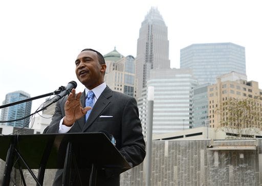 In this Nov. 7, 2013 photo, Charlotte Mayor-elect Patrick D. Cannon speaks at his first post-election appearance at Romare Bearden Park in uptown Charlotte, N.C. U.S. Attorney Anne Tompkins said Wednesday, March 26, 2014, that Charlotte Mayor Patrick Cannon is facing theft and bribery charges. Tompkins says Cannon solicited and accepted bribes from undercover FBI agents posing as real estate developers who wanted to do business in Charlotte. (AP Photo/The Charlotte Observer, Jeff Siner)