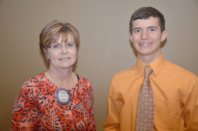 Christopher Martin, a senior at Early High School, and club President Penny Riggs.