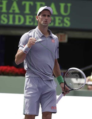 Novak Djokovic, of Serbia, pumps his fist after defeating Tommy Robredo at the Sony Open Tennis tournament, Tuesday, March 25, 2014, in Key Biscayne, Fla. (AP Photo/Lynne Sladky)