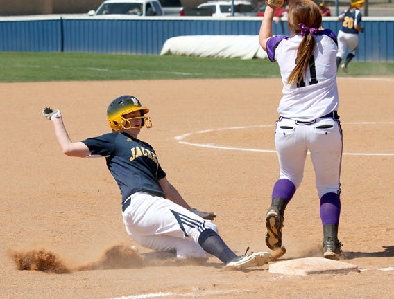 Lady Jacket Amanda Gober slides safely into third base prior to scoring Howard Payne’s second run in Saturday’s 8-3 ASC victory over Ozarks.