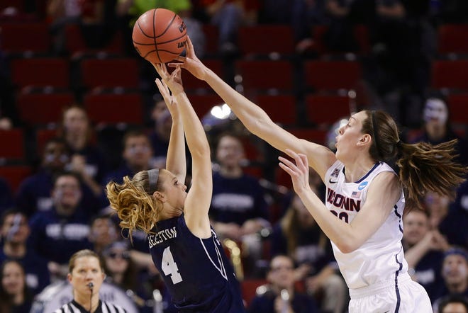 BYU’s Kim Beeston is blocked by UConn’s Breanna Stewart Saturday during the first half of their NCAA women’s tournament game in Lincoln, Neb. The Huskies advanced to the Elite Eight with a 70-51 victory. photos by tHE ASSOCIATED PRESS
