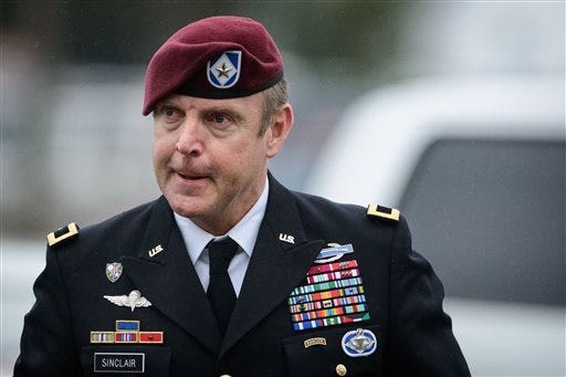 In this March 19, 2014 file photo, Brig Gen. Jeff Sinclair arrives to the Fort Bragg courthouse, for his sentencing hearing, in Fort Bragg, N.C. Sinclair, who was accused of sexually assaulting a subordinate, plead guilty to lesser charges in a plea deal reached with government prosecutors. As part of the Special Victims Counsel, Capt. Cassie L. Fowler said her sole mission was to protect the woman at the center of the case against Sinclair.