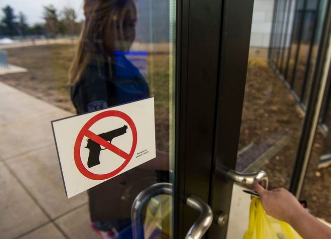 ICC student Kayla Moore heads into the CougarPlex. ICC's new gun policy crafted in response to the Illinois Firearm Concealed Carry Act does not allow people to exercise concealed carry on ICC campuses. Moore said, "I think it's a little obvious that you shouldn't bring a gun to an education institution, but I guess some people don't get that."