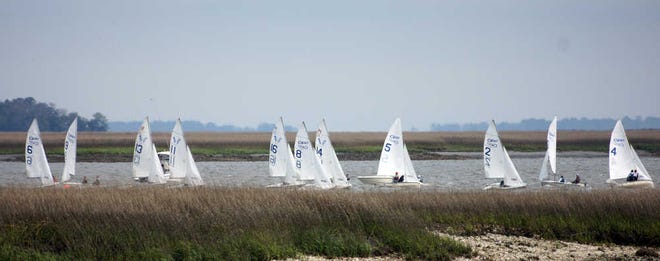 Jamie Parker/Bryan County Now Sailors work for position to round a bouy during the South Atlantic Interscholastic Sailing Association's District Championships for high school sailing this weekend at Sunbury.