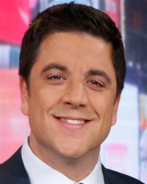 File-This Feb. 20, 2013 file photo released by ABC shows Josh Elliott, on the set of "Good Morning America" in New York. ABC's top-rated "Good Morning America" has suffered its second personnel defection in four months, with news anchor Elliott telling the network on Sunday March 30, 2014, that he's leaving for a job at NBC Sports. (AP Photo/ABC, Heidi Gutman, File)