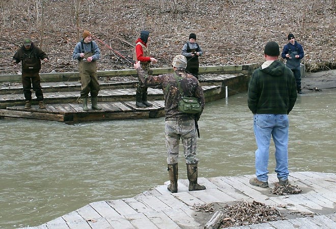 Fishermen are lined up on both sides of Catharine Creek Tuesday for the opening day of trout season. Shawn Vargo/The Leader