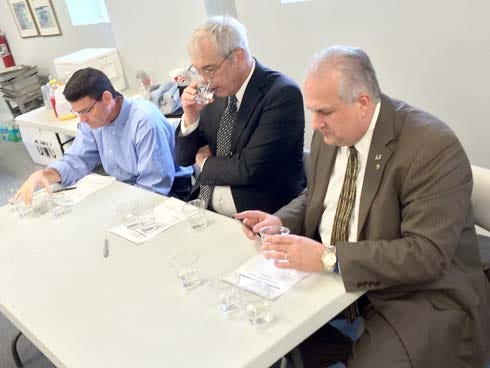Contest judges Ted Corcoran, Don David III and Doug Barr sip water recently.