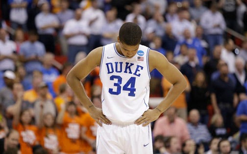 Duke senior Andre Dawkins walks off the court after the Blue Devils' loss to Mercer in the NCAA Tournament.