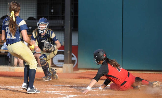 Alex Hugo (16) slides safe into home during an NCAA collegiate softball game between Georgia Tech and the University of Georgia on Wednesday, Apr. 2, 2014 in Athens, Ga. (Photo by Sean Taylor)