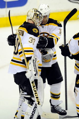 Boston Bruins right wing Jarome Iginla, right, celebrates their 4-2 win over the Washington Capitals with goalie Chad Johnson on Saturday, March 29, 2014, in Washington.