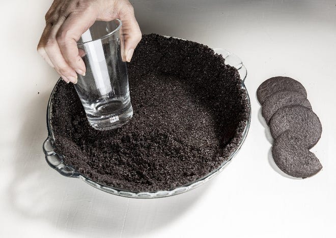 A glass can come in handy when you're making a cookie-crumb pie crust.