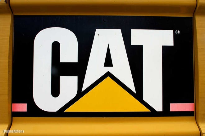 FILE - In this June 13, 2012 file photo, the Caterpillar logo is seen on earth moving equipment in Springfield, Ill. (AP Photo/Seth Perlman, File)
