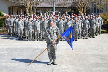 Senior Airmen from Class 14-C of the Vincent Airmen Leadership School pose in front of the school at Hurlburt Field. The class graduated from ALS during a ceremony at the Sounside Club March 27.
