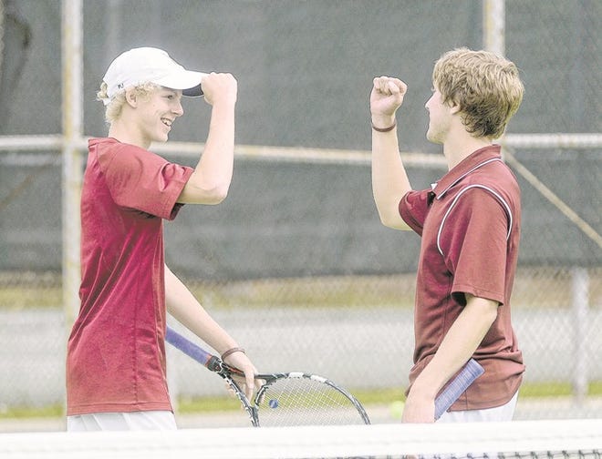 Niceville's PJ Shaw, left, and doubles partner Behrens Watkins celebrate a semifinal win over Chiles in Wednesday's District 2-3A tournament at the Fort Walton Beach Tennis Center.