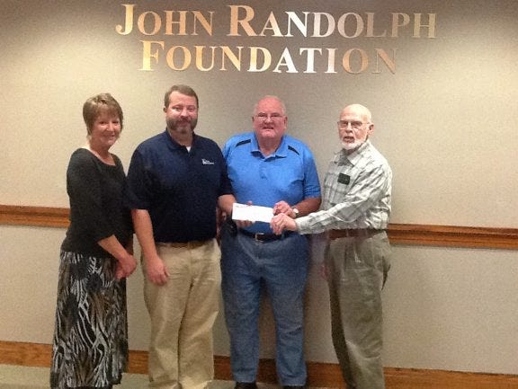 The Prince George Emergency Crew will work with the John Randolph Foundation to manage the Marion B. Williams - Prince George Emergency crew Scholarship. From left are: Lisa Sharpe, executive director, John Randolph Foundation; Andy Clark, JTF Scholarship Committee chairman; and Paul Hamby and Hugh Mumford, Prince George Emergency Crew members.