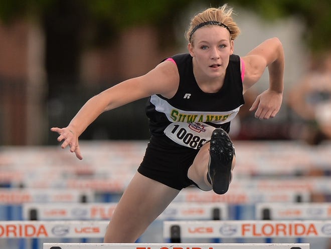 Suwanee's Logan Boss competes in the 100-meter hurdles at the Florida Relays in at Percy Beard Track in 2013.