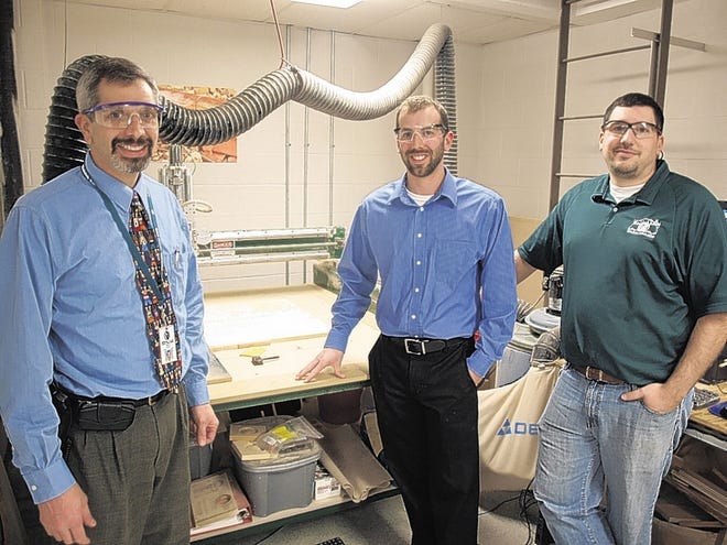 Minisink Valley Middle School Principal Michael Giardina, left, a supporter of the Technology program stands next to the CNC Router with teachers Rich Budd, center and Chris Corwin.