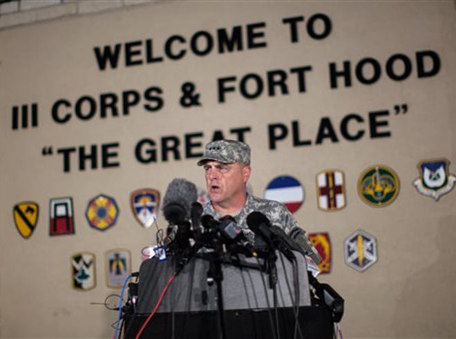Lt. Gen. Mark Milley, commanding general of III Corps and Fort Hood, speaks with the media outside of an entrance to the Fort Hood military base following a shooting that occurred inside, Wednesday, April 2, 2014, in Fort Hood, Texas. Four people were killed, including the gunman, and 16 were wounded in the attack, authorities said.