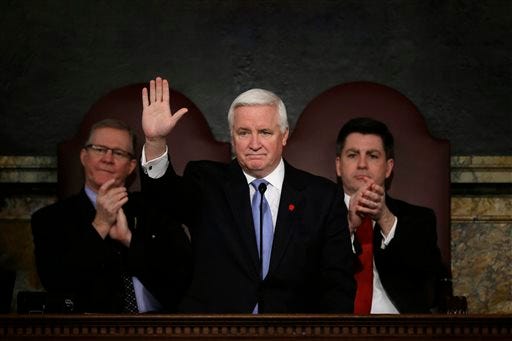 In this Feb. 5, 2013 file photo, Pennsylvania Gov. Tom Corbett delivers his budget proposal for the fiscal year 2013-2014 to a joint session of the Pennsylvania House and Senate, in Harrisburg, Pa. Speaker of the Pennsylvania House of Representatives, Rep. Sam Smith, R-Jefferson, is seated left, and is accompanied by Pennsylvania Lt. Gov. Jim Cawley. (AP Photo/Matt Rourke, File)