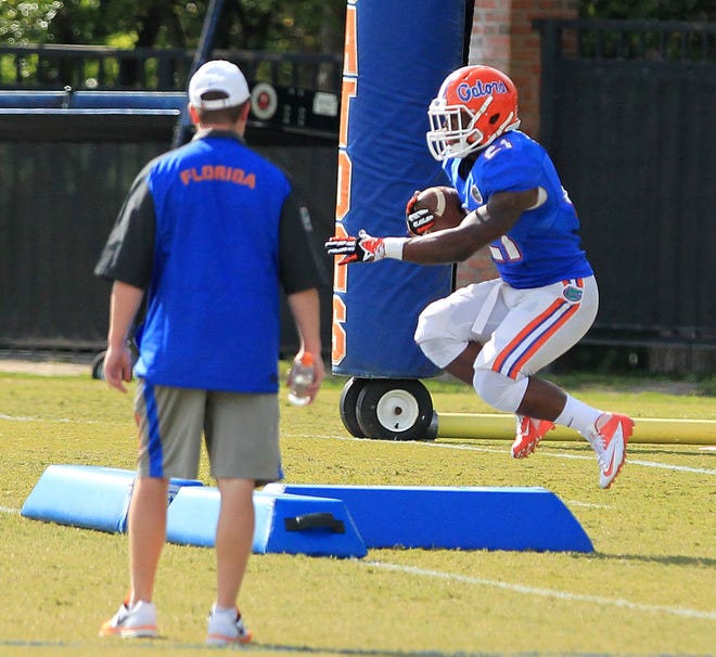 Florida running back Kelvin Taylor performs a drill at an open spring practice at the Sanders Practice Fields on Monday.