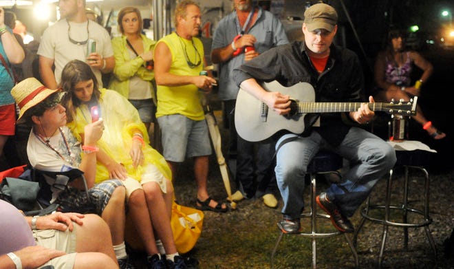 Jeremy Jackson performs an impromptu acoustic set after his stage performance was cancelled for weather  at RiverFest in Gadsden on Saturday June 1, 2013.

Gadsden Times Photo by Eric T. Wright