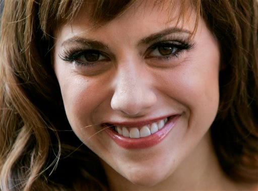 FILE - In this June 27, 2005 file photo, actress Brittany Murphy arrives to launch the summer sale of the Harrods department store in central London. Murphy's final movie opens Friday, April 4, 2014 in Eugene, Ore. The actress died at age 32 in December 2009. That year she worked on a psychological thriller called "Something Wicked," and much of it was filmed in Eugene. The movie failed to get a distribution deal with the large studios. But producer and local businessman Scott Chambers says that Regal Cinemas is giving the film a four-state test run over the coming month before deciding whether to roll it out beyond the Northwest. AP Photo/Matt Dunham, File)