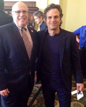State Rep. Steven Howitt, left, poses with actor Mark Ruffalo at the Statehouse.