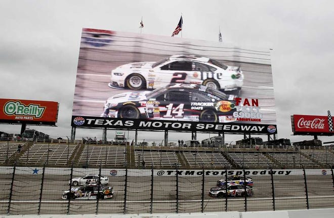 Mike Stone Associated Press A giant TV screen shows Brad Keselowski (2) and Tony Stewart (14) during the Sprint Cup race at Texas Motor Speedway Monday.