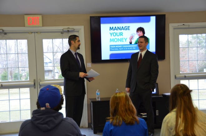 Shane Pfrommer and Michael Woods from Univest Bank in Doylestown, speak with teens at Central Bucks Family YMCA about money management.