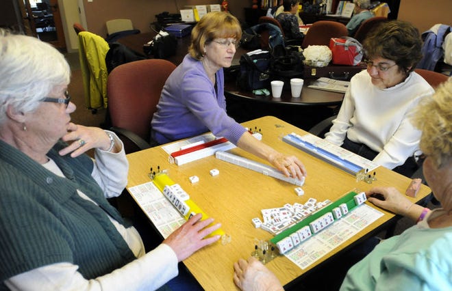 L to R, Evelyn McCarthy, Carol Rawa, Jean Tyrell and Peg Richards play a game of Mah Jong in one of the rooms of the Pennridge Community Center. The Center is celebrating its 50th anniversary this year.