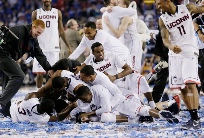UConn players celebrate beating Kentucky and winning the national championship on Monday night.