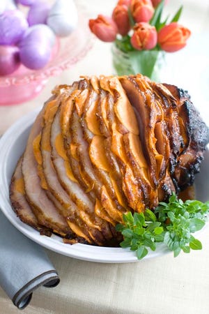 This March 10, 2014 photo shows glazed sweet potato stuffed ham in Concord, N.H. (AP Photo/Matthew Mead)