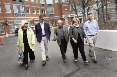 Walking from the Portsmouth Sheraton Harborside Hotel to the parking lot across the street are HarborCorp representatives, from left, Margaret Griswold, Chris Thompson, Terry Nadeau, Shari Young and Jed Troubh.