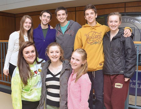Models and model escorts for the Mr. Tux Fashion Show to be held April 12 to benefit Exeter High School's Junior Prom pose before a prom committee meeting recently. Bottom row, left to right are Emily Blood, Bailee McGlynn and Emily Pierce. Standing left to right are Hannah McDonnell, Silas Richards, Griffin Poutre, Cam Breton and Megan Berry.
Suzanne Laurent photo