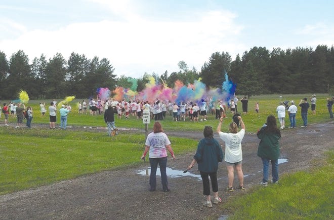 The inaugural Splash of Color Fun Run/Walk was held in Rudyard in 2013. This file photo shows Splash of Color 2013 participants taking pleasure in the color party in between the 2k and 5k events. This year’s Rudyard Pool Committee fundraiser is scheduled for May 31.