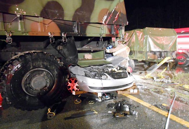 This photo from the Newport Police Department shows a 2005 Saturn driven by Christian Javier Garcia, 20, of Newport, underneath a military truck after a collision Monday night in Newport. Garcia died in the crash.