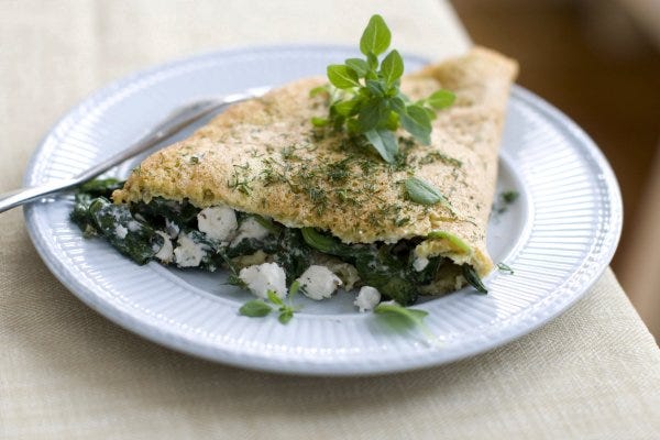 This Greek-style souffled omelet is made with spinach and feta cheese.