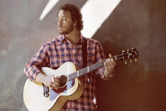 Amos Lee performs on Saturday at the Ovens Auditorium in Charlotte.