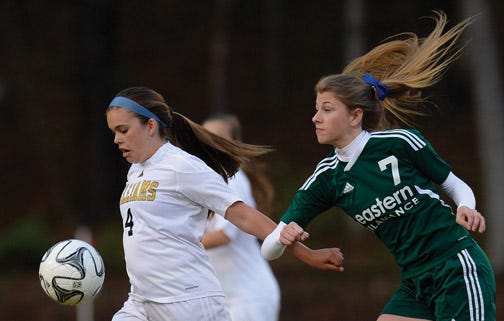 Williams High School's Kathryn Ysteboe makes a play on the ball in front of Eastern Alamance's Sara Jackowski during a Mid-State 3-A Conference girls' soccer game Tuesday night.