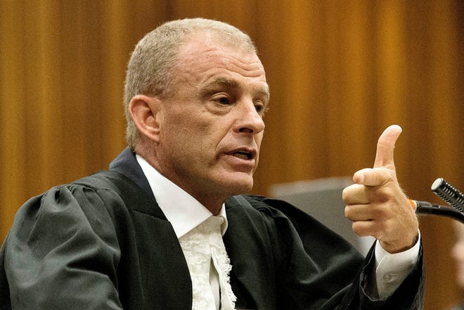 State prosecutor Gerrie Nel during cross questioning of Oscar Pistorius in court in Pretoria, South Africa, Thursday, April 10, 2014. Pistorius is charged with the murder of his girlfriend Reeva Steenkamp, on Valentines Day in 2013. THE ASSOCIATED PRESS