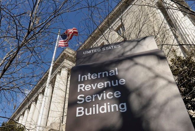 This March 22, 2013 file photo shows the exterior of the Internal Revenue Service building in Washington. An Internet connection, a tax return form and a stolen identity are enough to fuel a multi-billion-dollar criminal enterprise that has proven too pervasive to stop. Thanks in part to technological simplicity and controls that struggle to keep pace with the crime, thieves are pocketing billions of dollars in stolen federal tax refunds. Over the last year, the IRS paid out $4 billion in bogus tax refunds to fraudsters using someone else’s personal information. (AP Photo/Susan Walsh, File)